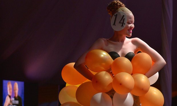 A contestant walks down the catwalk in her own creation. Photograph: Tony Karumba/AFP/Getty Images