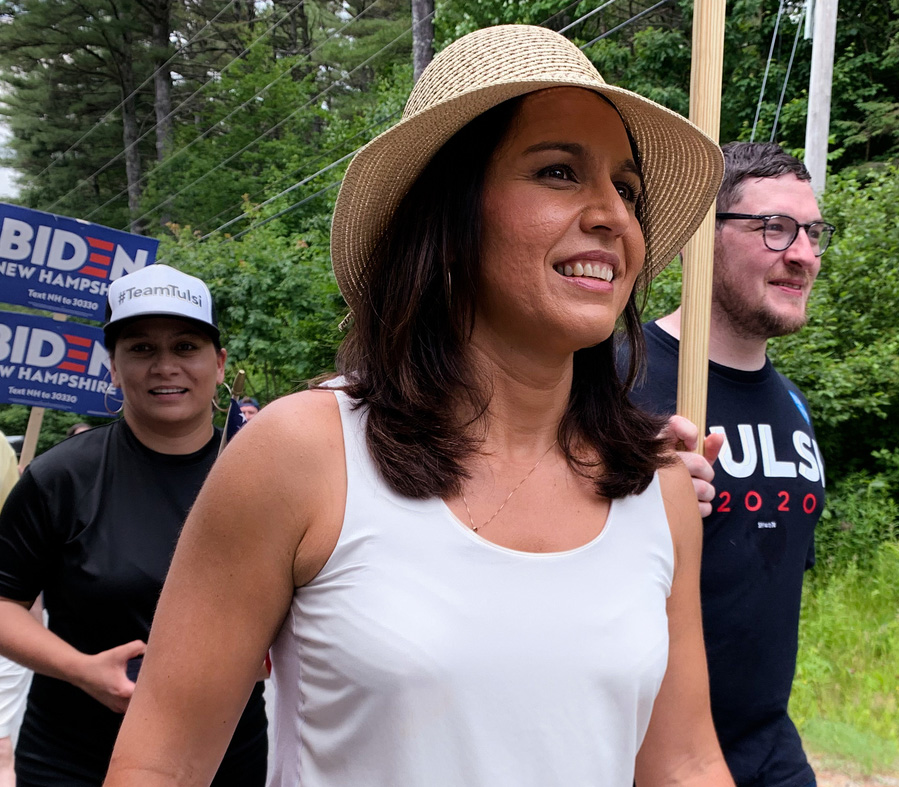 Tulsi Gabbard, seen in Franconia, N.H., on July 6, is one of nearly two doz...